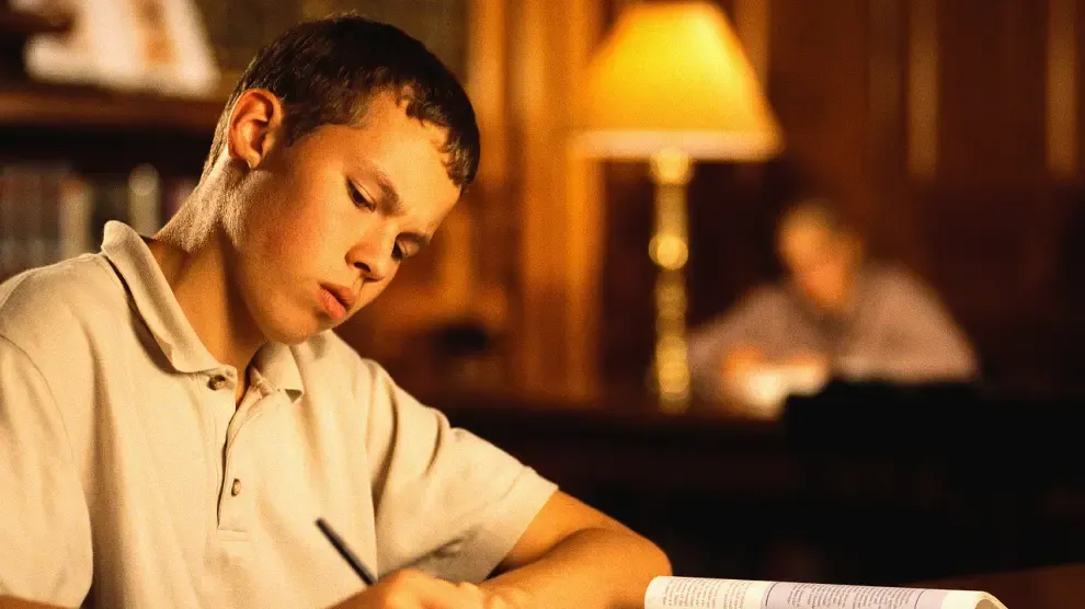 college student studying in library